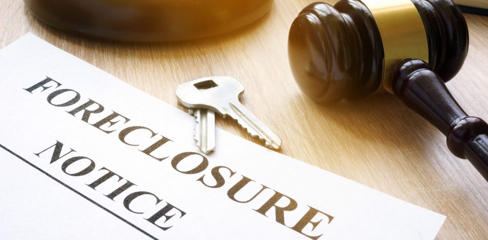 Foreclosure,Notice,And,Keys,On,A,Court,Table.
